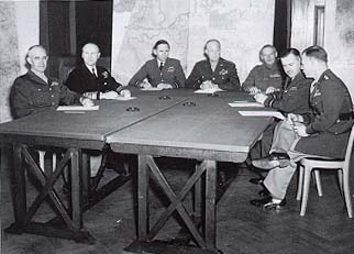 Photograph, Allied invasion planners. Left to right, General Bradley, Admiral Ramsay, Air Chief Marshal Tedder, General Eisenhower, General Montgomery, Air Chief Marshal Leigh Mallory, and General Smith.